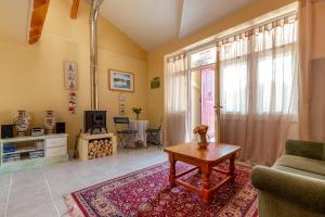 a living room with a couch and a table at Private gîte with stunning views & shared pool in Laussou