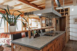 a kitchen with a sink and a counter top at Luxus Seaside Loft in Füssen