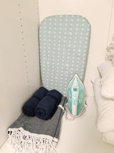 a room with a bed with blue pillows at Dunes Trail 2 in Melnragė +15 photos