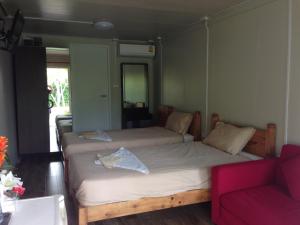 Ένα ή περισσότερα κρεβάτια σε δωμάτιο στο Check In and Chill Out