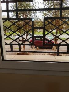 a view of a car through a window at Razzak in Rabat