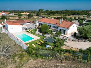 an aerial view of a house with a swimming pool at Quinta Sao Martinho in Reguengo Grande