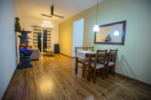 a living room with a table and chairs and a fireplace at Villa Ceilaoo in Galle +21 photos