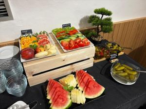 a buffet with fruits and vegetables on a table at LH Hotel Golden Wheel in Prague +45 photos