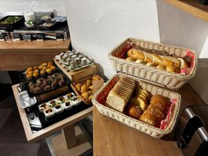 a bunch of different types of food in baskets at LH Hotel Golden Wheel in Prague