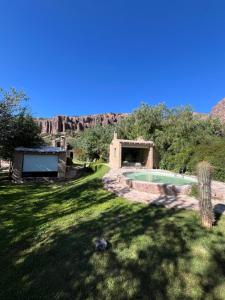 a yard with a swimming pool and mountains in the background at Casa Domo Juella in Juella