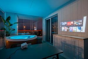 a jacuzzi tub in the middle of a room at Villa fronte mare in Bari +58 photos