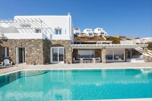a villa with a swimming pool in santorini at MichaelAngelo Villa in Mikonos