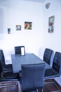 a table with four chairs and a blue table and chairsktop at Apartman Gajnice Zagreb in Zagreb +12 photos