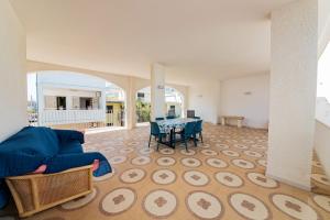 a living room with a couch and a table at Il Bacio del Sole - San Foca in San Foca