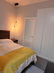 a bedroom with a bed and a closet and a door at LOFT La Placeta in Enguera