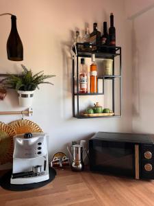 a kitchen with a coffee maker and a microwave at The Blue Window - Apartment - 300m from sea in Augusta +46 photos