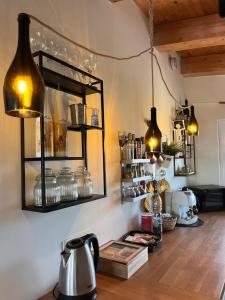 a kitchen with a counter with a mirror and lights at The Blue Window - Apartment - 300m from sea in Augusta