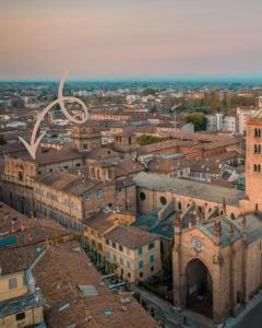 an aerial view of a city with a large symbol at Palazzo Giacometti Suites in Piacenza +23 photos