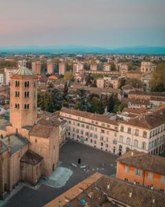 an aerial view of a city with buildings at Palazzo Giacometti Suites in Piacenza