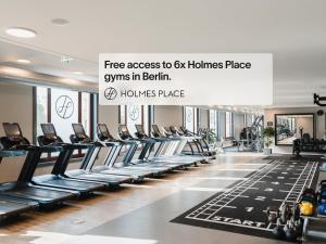 a gym with rows of treadmills at Numa Berlin Drift in Berlin