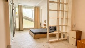 a bedroom with a bed in a room at The LH Homestay in Phú Quốc