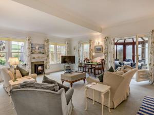 a large living room with couches and a fireplace at 2 Bed in Dorchester oc-59666 in Long Bredy