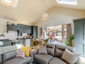 a living room with a couch and a kitchen at 2 Bed in York oc-81551 in Welburn
