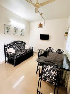 a bedroom with a bed and a table and chairs at A La Mer - Solis 3 in Varca