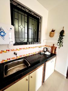 a kitchen with a sink and a window at A La Mer - Solis 3 in Varca +3 photos