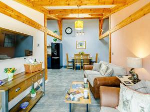 a living room with a couch and a table at 2 Bed in Ripon oc-85510 in Masham +9 photos