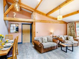 a living room with a couch and a table at 2 Bed in Ripon oc-85510 in Masham