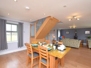 a dining room and living room with a table and chairs at 2 Bed in Consett oc-smidc in Lanchester