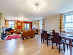 a large living room with a table and chairs at 3 Bed in Consett oc-29408 in Lanchester