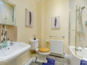 a bathroom with a toilet and a sink and a shower at 3 Bed in Consett oc-29408 in Lanchester +17 photos
