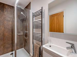 a bathroom with a shower and a sink at 3 Bed in York oc-93897 in Tollerton +20 photos