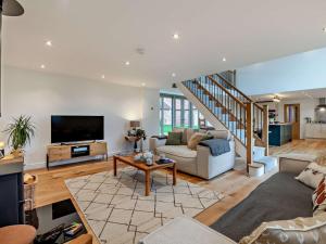 a living room with a couch and a tv at 4 Bed in Brough oc-93496 in Brough