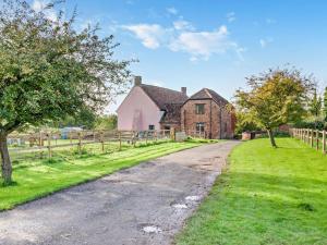 an old house with a fence and a dirt road at 2 Bed in Taunton oc-93581 in Norton Fitzwarren