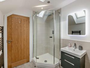 a bathroom with a shower and a sink at 4 Bed in Brough oc-93496 in Brough +35 photos