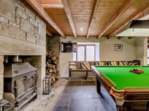 a pool table in a room with a fireplace at 3 Bed in Cornhill -on- Tweed oc-76374 in Carham