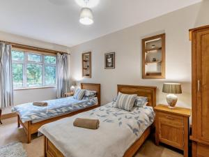 a bedroom with two beds and a window at 3 Bed in Cornhill -on- Tweed oc-76374 in Carham