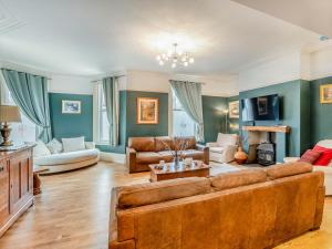 a living room with a large brown couch at 7 Bed in Bridlington oc-90787 in Bridlington
