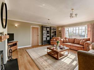 a living room with a couch and a table at 3 Bed in Thirsk oc-91245 in Sessay