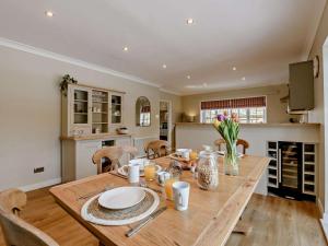 a kitchen and dining room with a wooden table at 3 Bed in Thirsk oc-91245 in Sessay