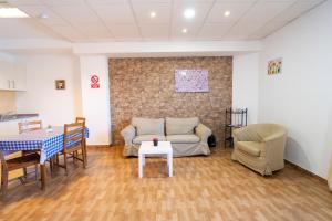 a living room with a couch and chairs and a table at Edificio Prieto VIV 2B in Puerto del Rosario