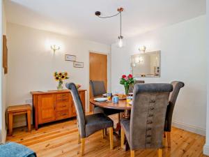 a dining room with a table and chairs at 3 Bed in Dorchester oc-92415 in Frome Vauchurch