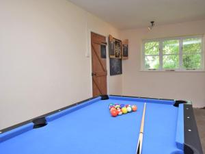 a pool table in a living room with afits at 3 Bed in Dorchester oc-92414 in Frome Vauchurch