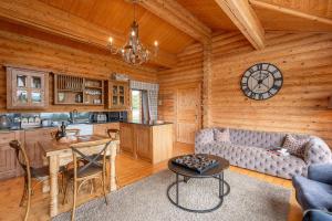 a living room with a couch and a table in a cabin at Penhill in Constable Burton
