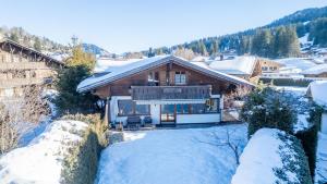 a house in the snow with snow covered ground at Chalet Eclipse, The Hidden Wonder in Hornkessel