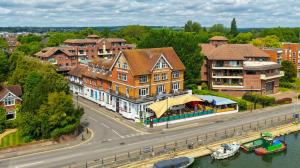 an aerial view of a town with houses and a street at Uno Thames Hotel -Reopened Brand New Again -FREE PARKING in Maidenhead