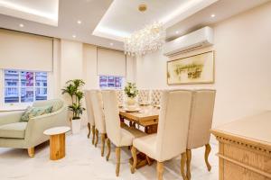 a dining room with a table and chairs at London Central Residence in London