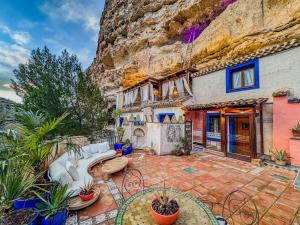 a house with a rock wall at XUQ Hotels Alaxara in Cubas