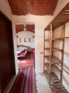a hallway with a room with a bunk bed at Azru hotel siwa in Siwa +9 photos