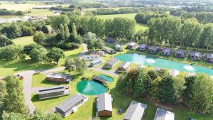 an aerial view of a resort with a pool and a group of houses at JJs Lodge Jorvik in Walkington