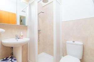 a bathroom with a shower and a toilet and a sink at La Encina in Port d'Alcudia +15 photos